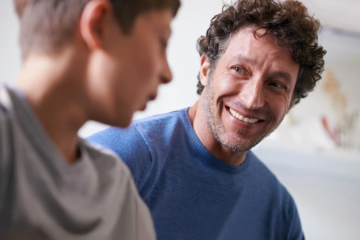 A parent and teenager sharing a calm, connected moment at home